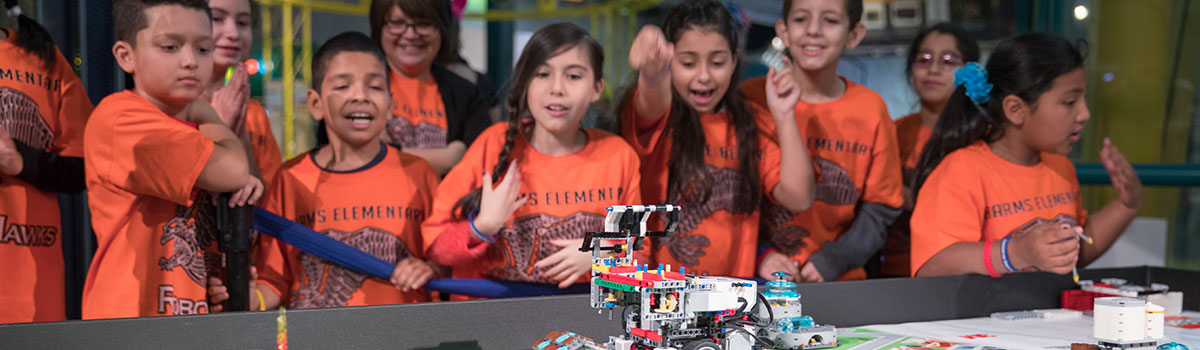 FIRST LEGO League team at competition table