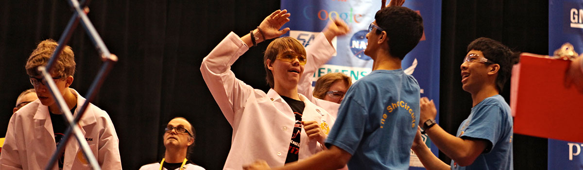 High-fives at FIRST Tech Challenge field