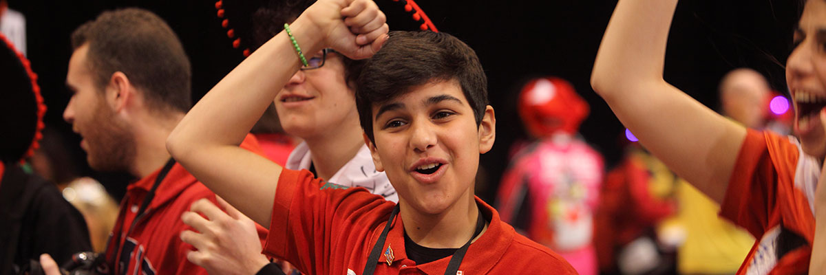 Happy FIRST LEGO League team member at event
