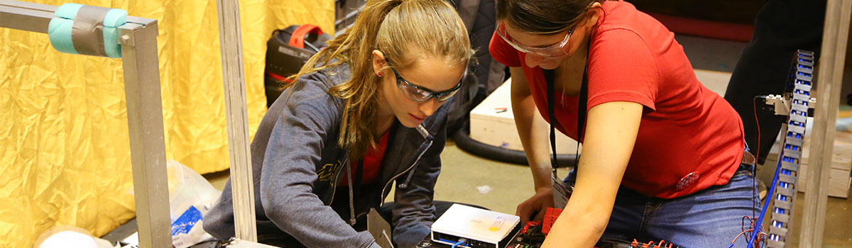 Team members working on their robot